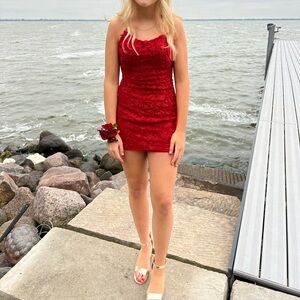 Sherri Hill 53151, size 4 with Red rhinestones and flower overlay